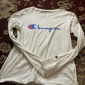 Champion long sleeve tee in the color white also in a kids XL.